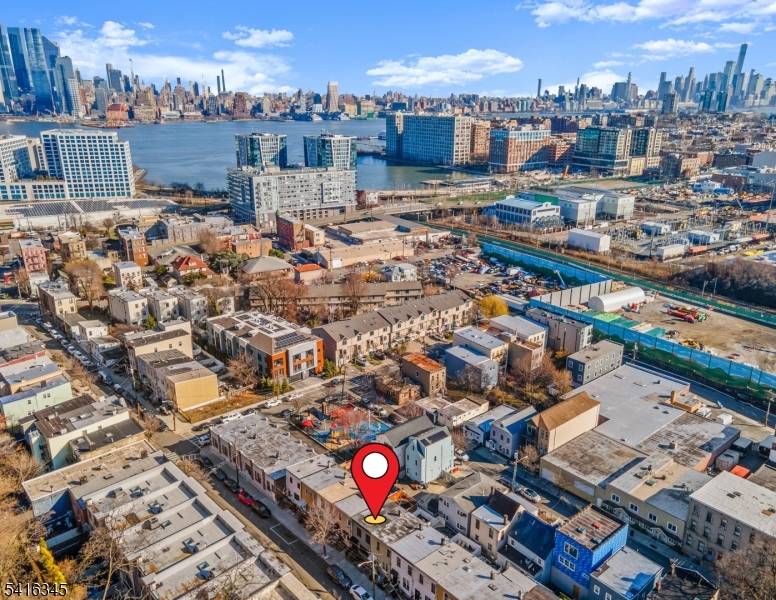 Charming three finished floor row home located in the vibrant and historic Shades of Weehawken, just moments from NYC and only a short stroll into Hoboken.