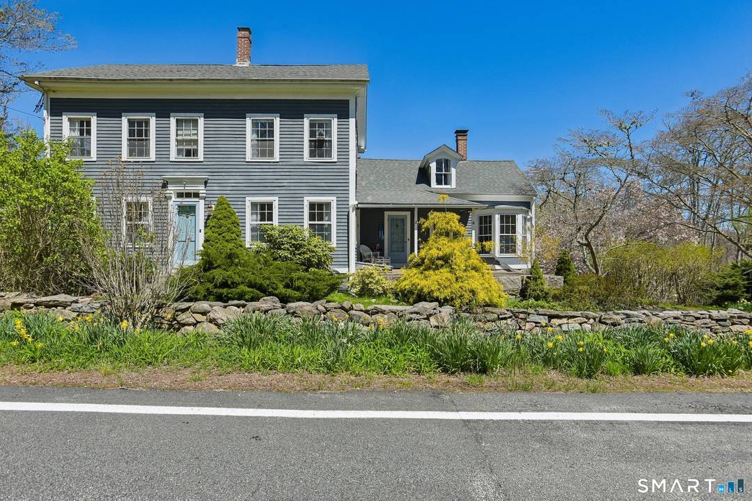 Located in Stonington, 1246 Pequot Trail is a timeless treasure that perfectly blends historic charm with modern potential.