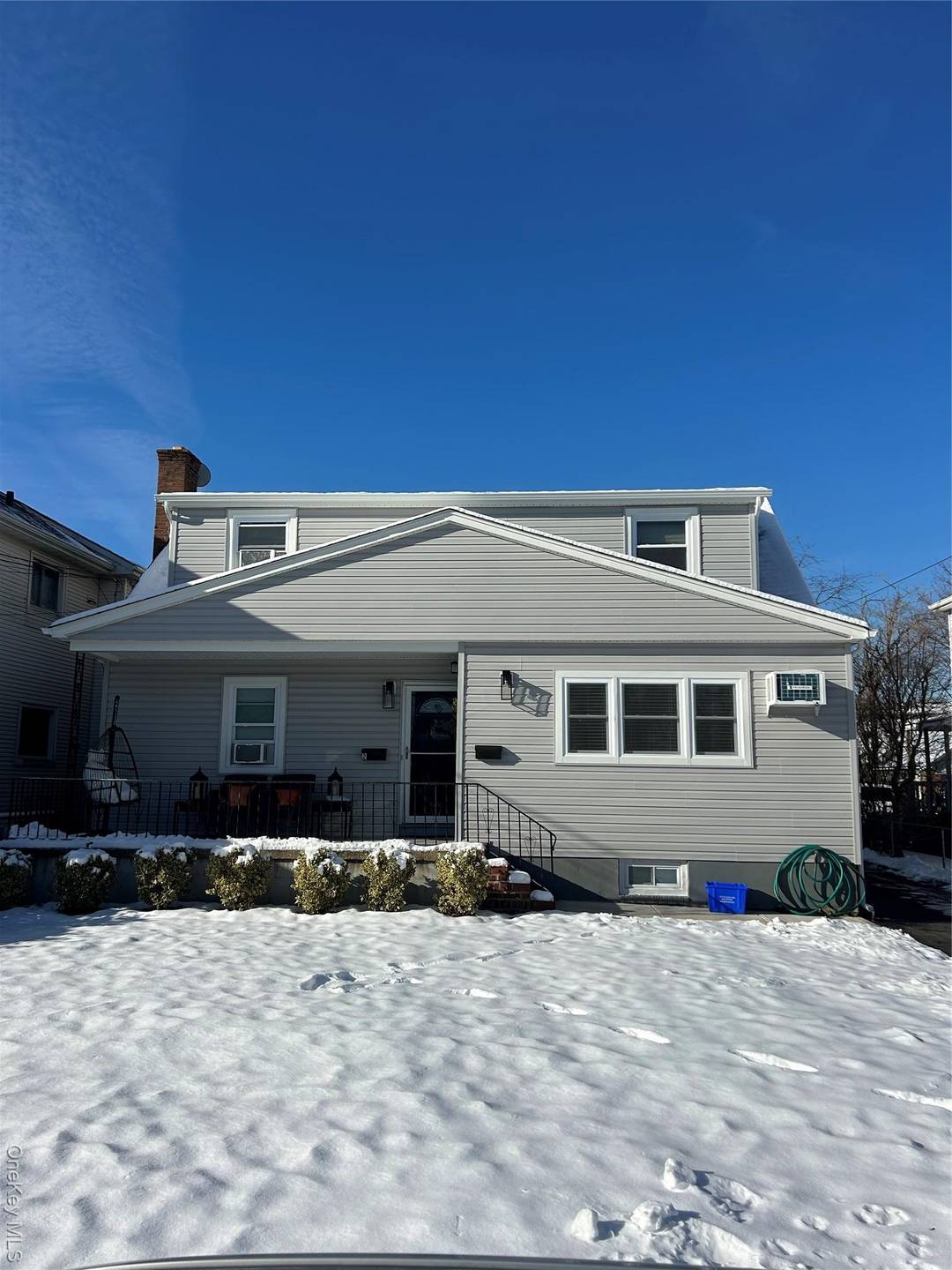 Stunning newly renovated 3 bedroom, 2 bath residence offering a modern open concept kitchen, front and rear porches, private driveway parking with EV charging, and a fully finished basement with ...