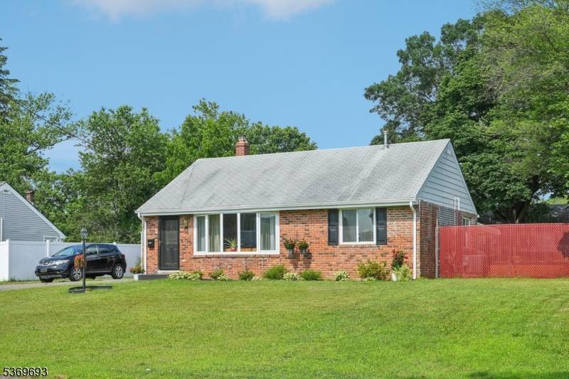 Welcome home to this well maintained Expanded Ranch nestled on a beautifully landscaped lot.