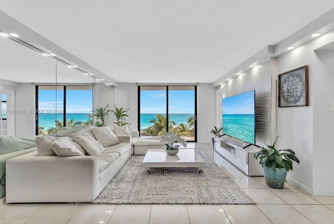 Wake up each morning to breathtaking sunrises over the shimmering Atlantic from this expansive, direct waterfront Miami Beach condo.