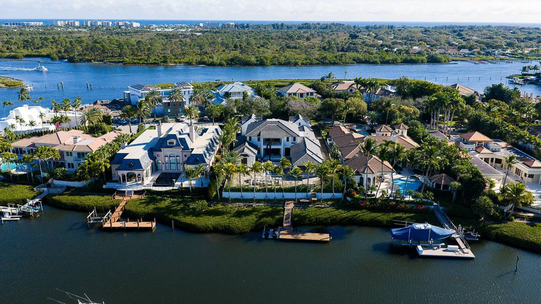 A nearly complete brand new waterfront estate home, on one of the most exclusive private island streets in all of Admirals Cove.