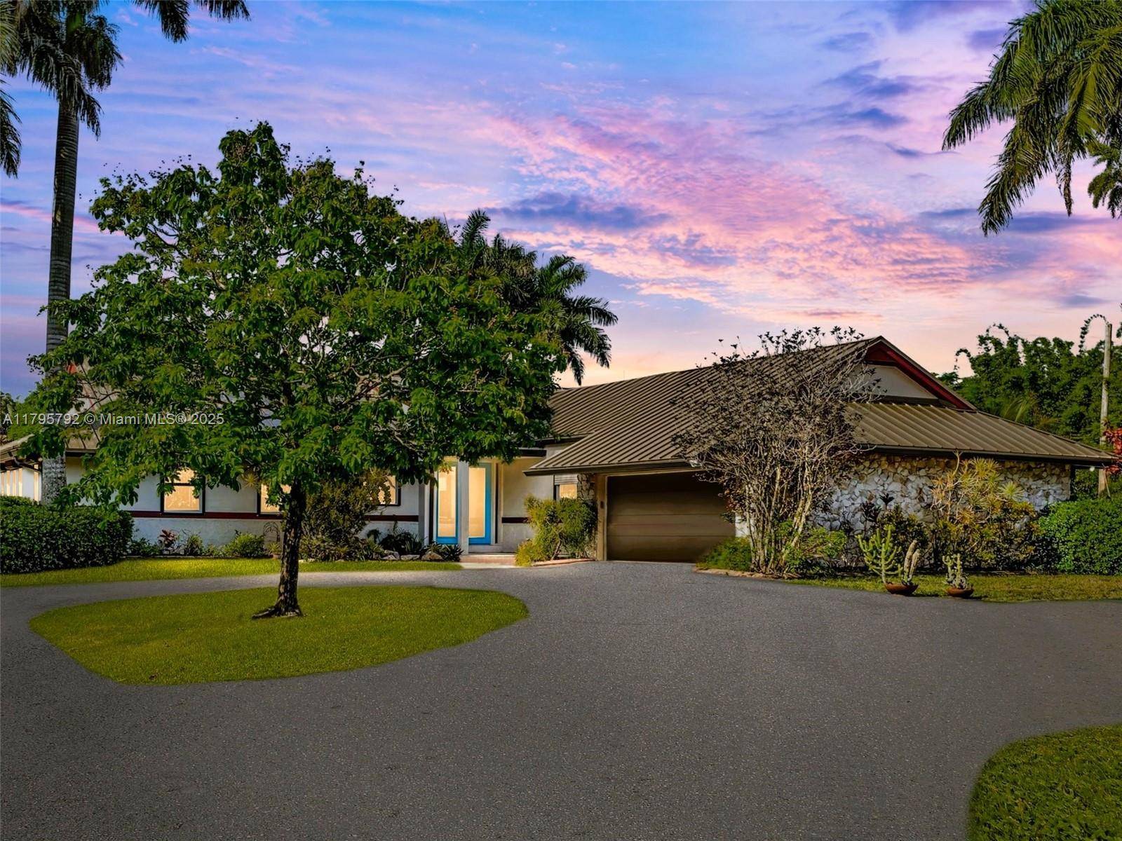 Drive through the gate and follow the tree lined driveway to this uniquely stunning estate nestled on over 2 acres and set on one of the most coveted streets in ...