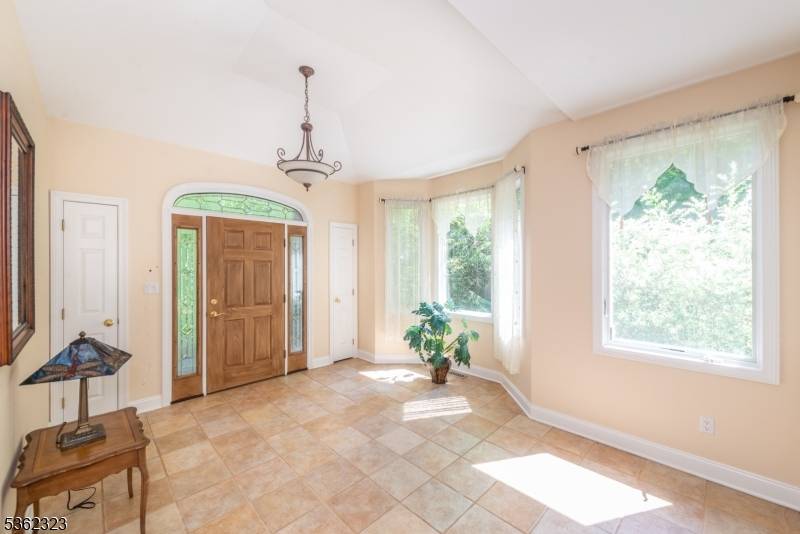 Welcome to this custom Colonial entertainer's dream home !