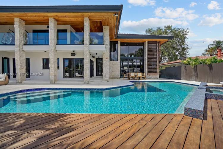 Experience luxury in this stunningly remodeled waterfront pool home in Miami.