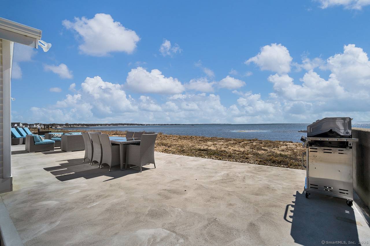 Experience coastal living at its finest in this gorgeous furnished rental located directly on the waterfront, overlooking the serene beauty of Long Island Sound.