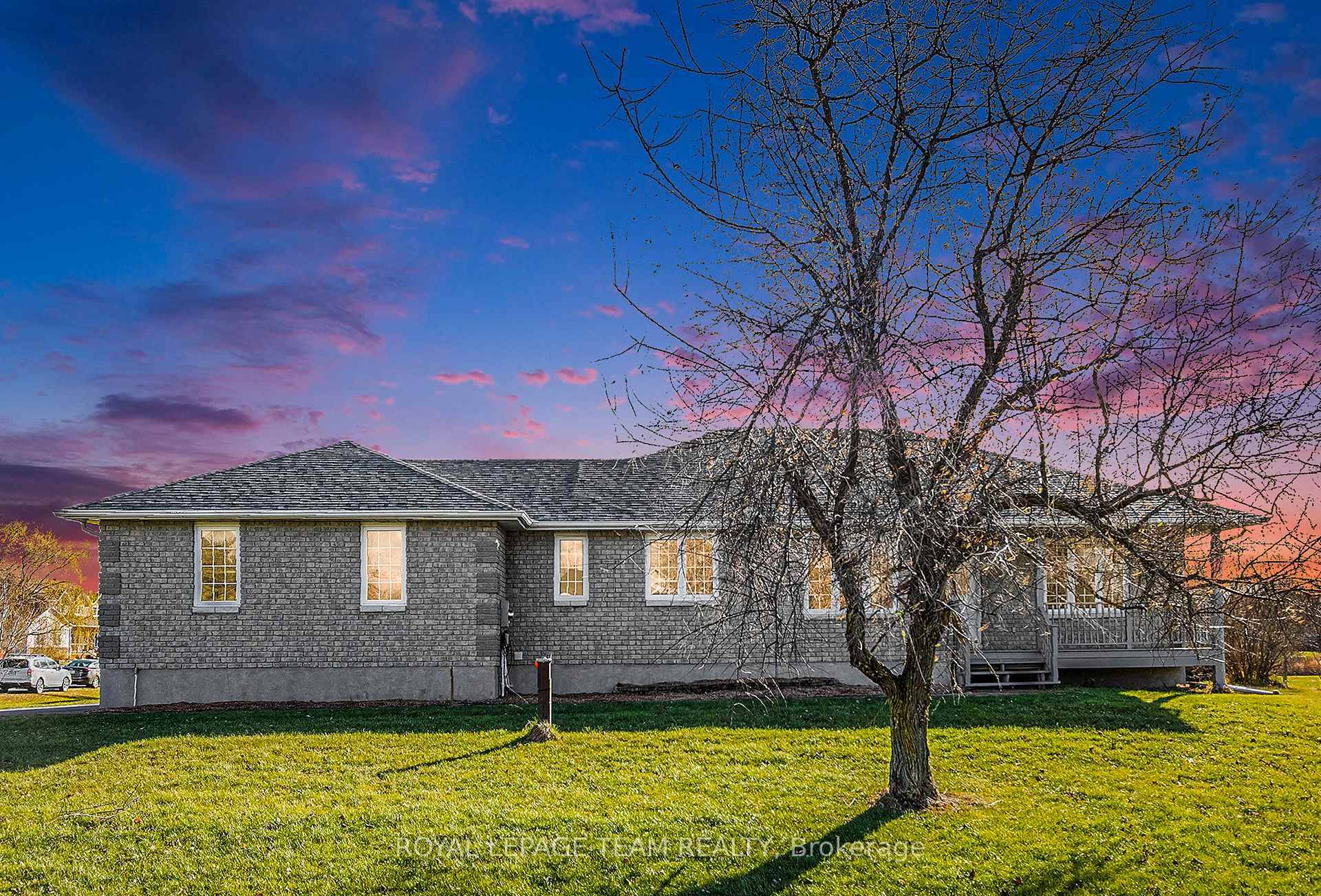 Nestled within the prestigious community of Settlers Grant, this distinguished all brick bungalow exemplifies refined country living.