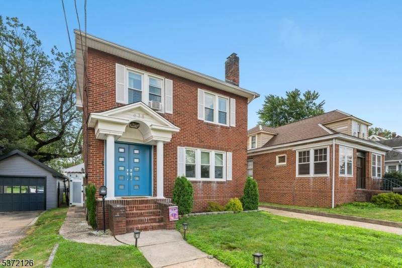 Welcome to this elegant traditional brick Colonial, where timeless architecture meets warm, modern upgrades.