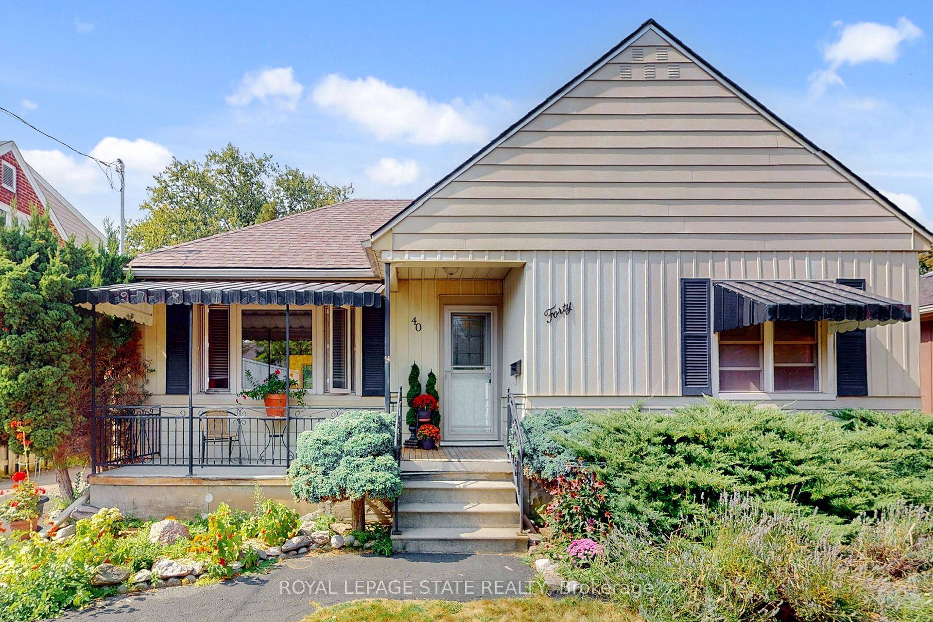 LOCATION ! ! Charming bungalow in Stoney Creek with a separate side entrance, spacious basement, parking for 4 and excellent location.