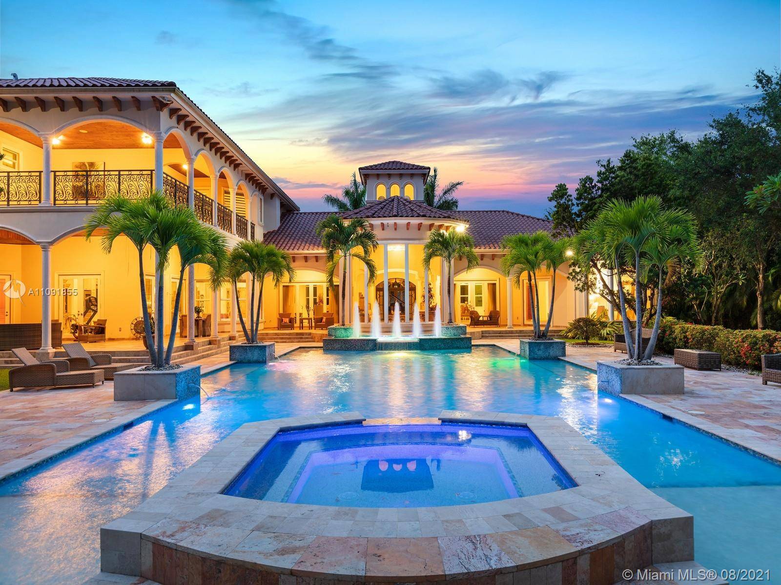 Extravagant one acre North Pinecrest Estate surrounded by pristine landscaping exotic koi ponds.