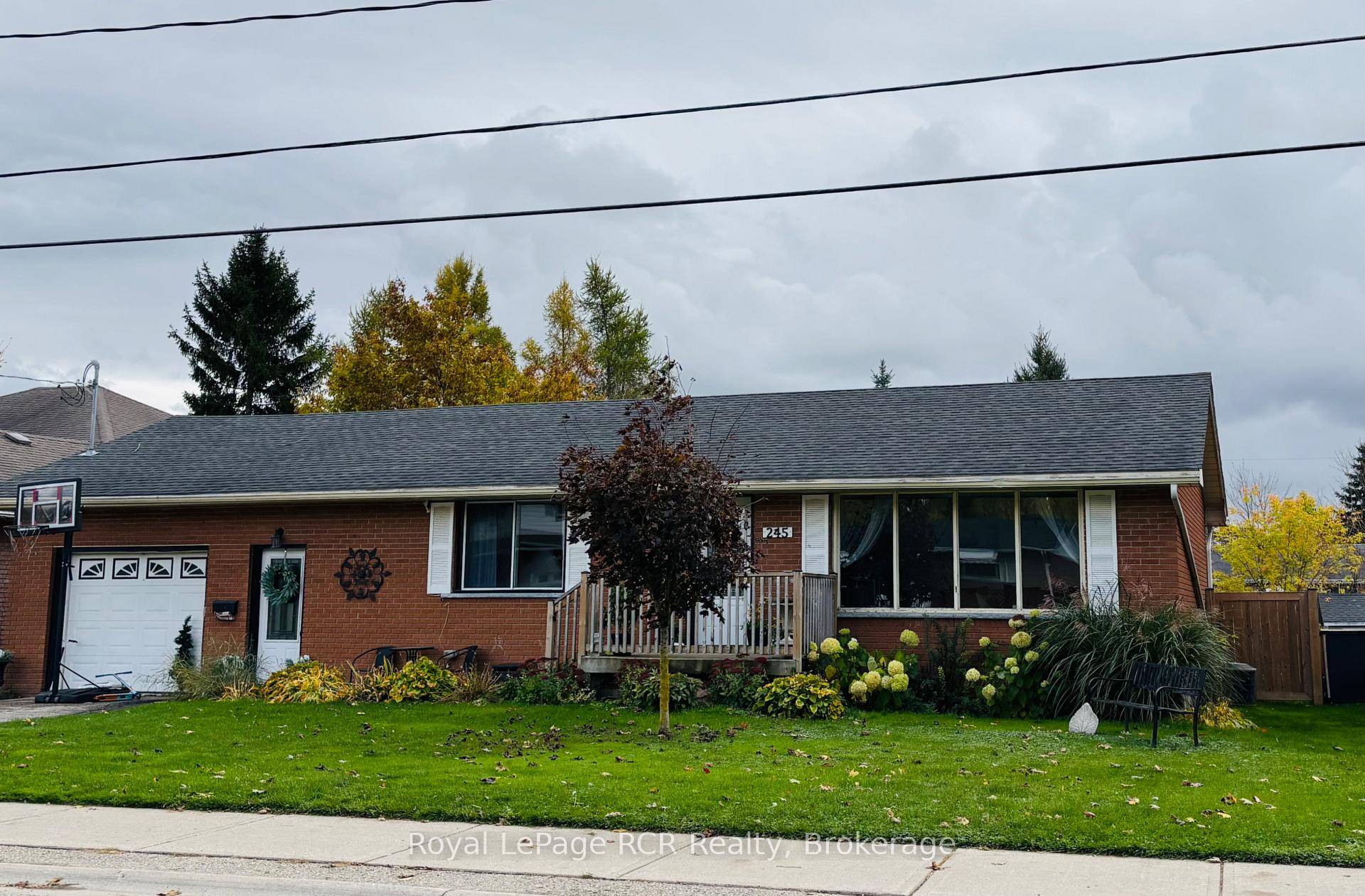 Welcome to this solid brick bungalow with an attached garage, perfectly situated for convenience and family life.