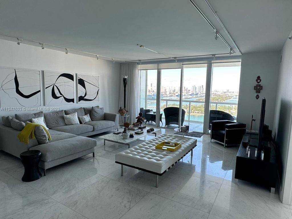 Luxurious high floor unit at the prestigious ICON in Miami Beach with spectacular views of the Bay and the Miami Skyline from the living room and both bedrooms.