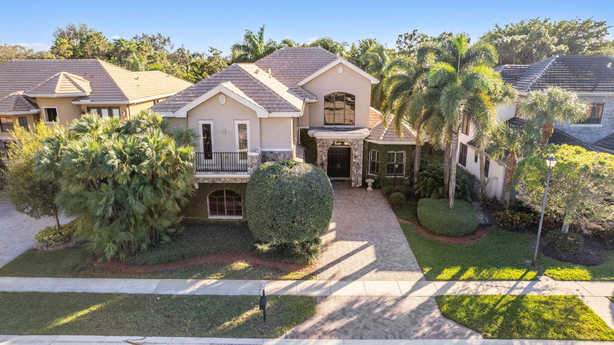 An exceptional estate home located within the prestigious guard gated community of Versailles.