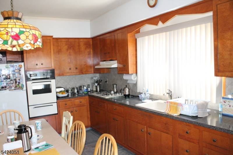 Spacious two family home offering 6 bedrooms, 3 full baths, large dining room and kitchens, level and inviting backyard, plenty of parking in exclusive driveway.