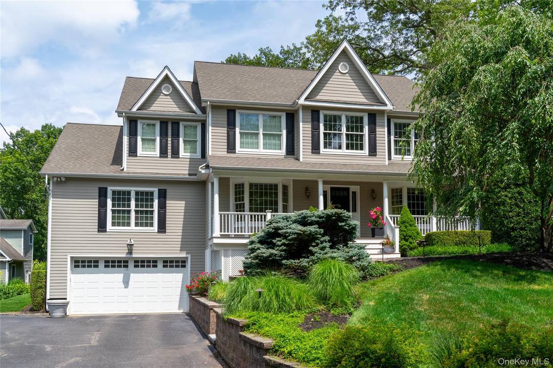 Beautiful custom built colonial located in sought after Northport, NY, set on a serene and professionally landscaped.