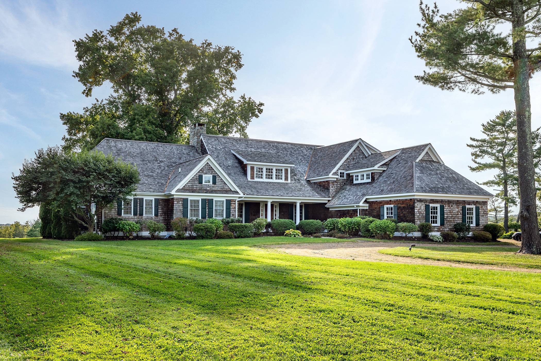 SUPERB LAKE PROPERTY. First time on the market, this 4, 811 sf shingle style home on 6.