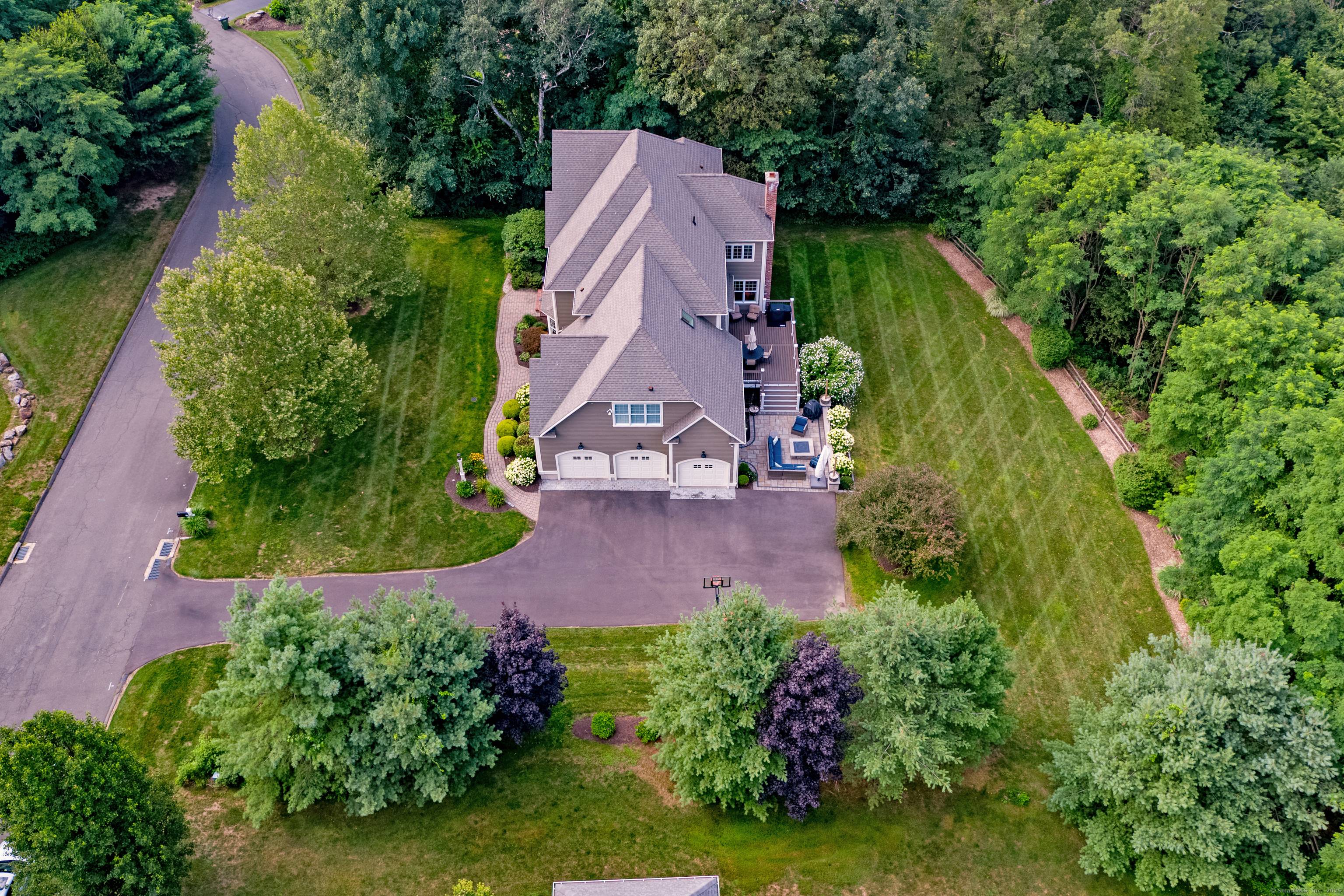 Surrounded by lush private lawns colorful blooming landscapes that beautifully enhance its picturesque curb appeal, this finely crafted custom Colonial seamlessly blends timeless design elements w a light airy ambiance.