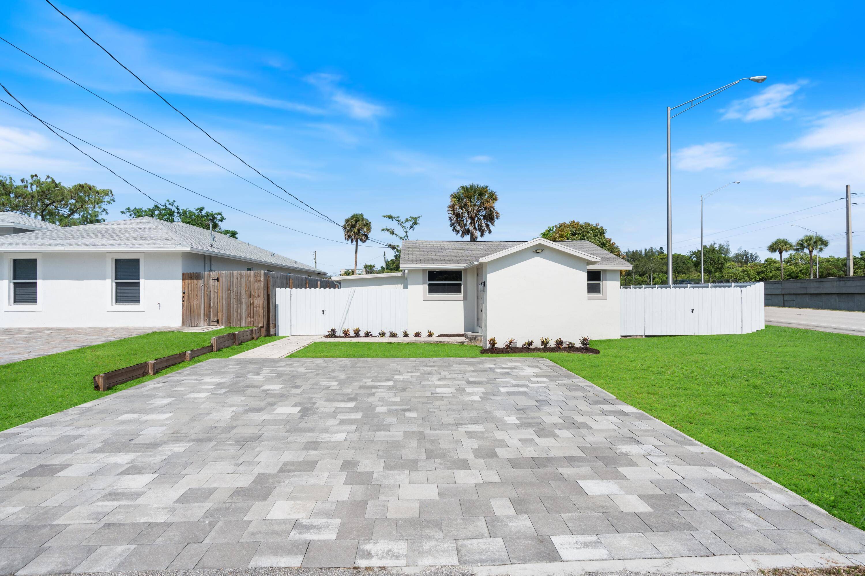 Discover this fully renovated single family home located on a spacious corner lot in the heart of West Palm Beach !