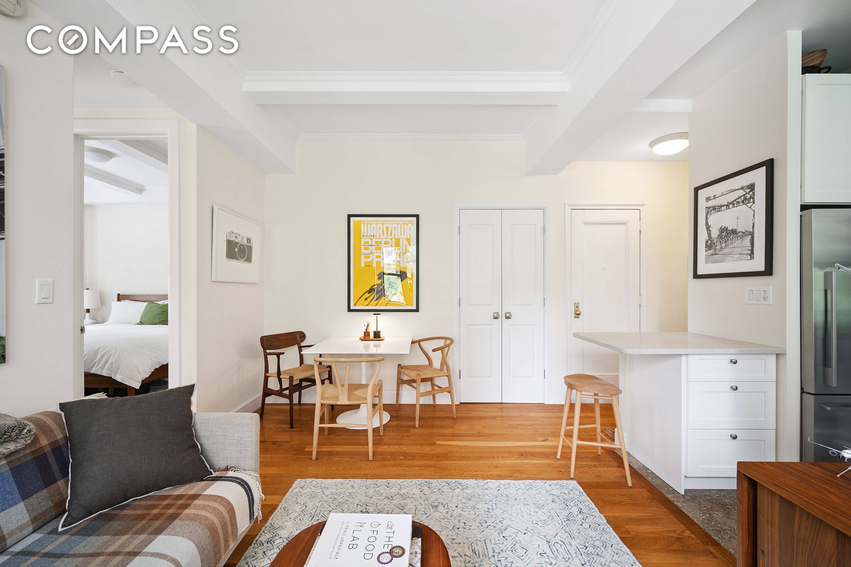 This quiet and sunny corner two bedroom pre war home offers East and North exposures, soaring 10 ceilings with exposed beams, and a host of thoughtful, custom architectural upgrades throughout.