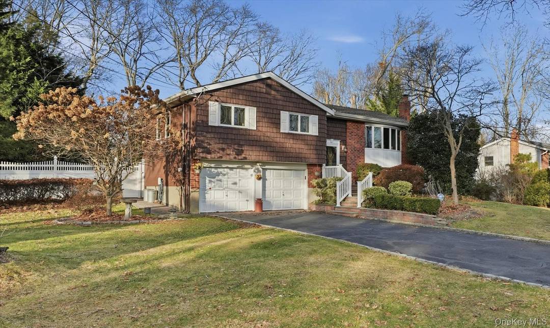 Immaculate, 3 bedroom 2 bath split level home with hardwood floors, woodburning fireplace 2 car garage.