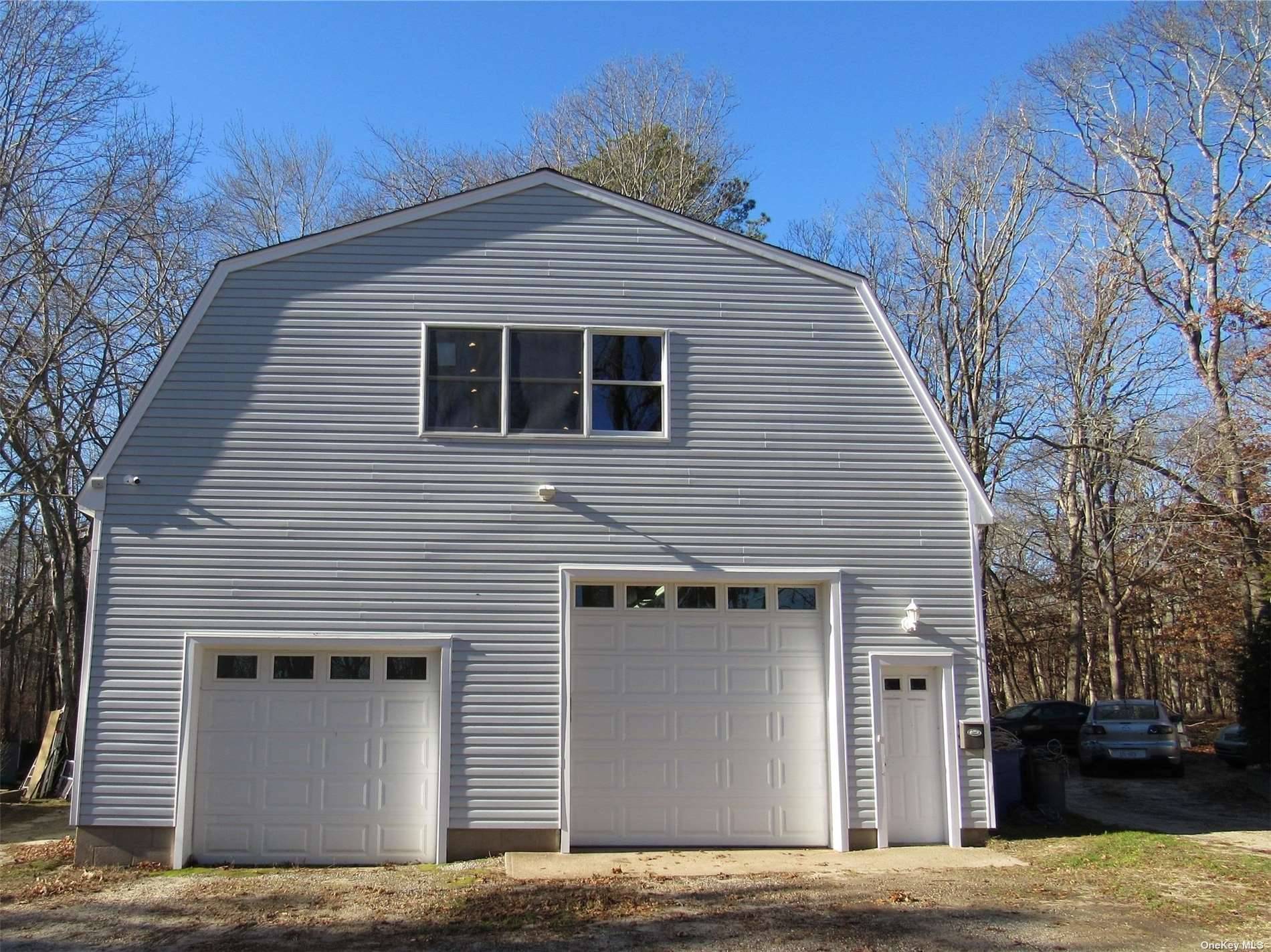 Oversized 33X40 2 car garage with heated and air conditioned second floor stroage area.