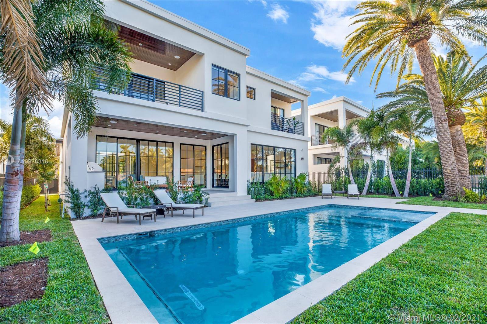 New construction luxury waterfront and designer decorated residence in the exclusive and private community of Belle Meade.