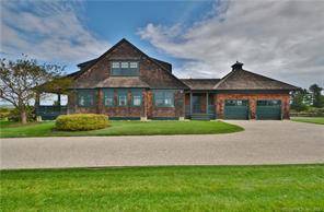 This traditional Fenwick cedar shingle style home has spectacular water views of the Connecticut River and South Cove.
