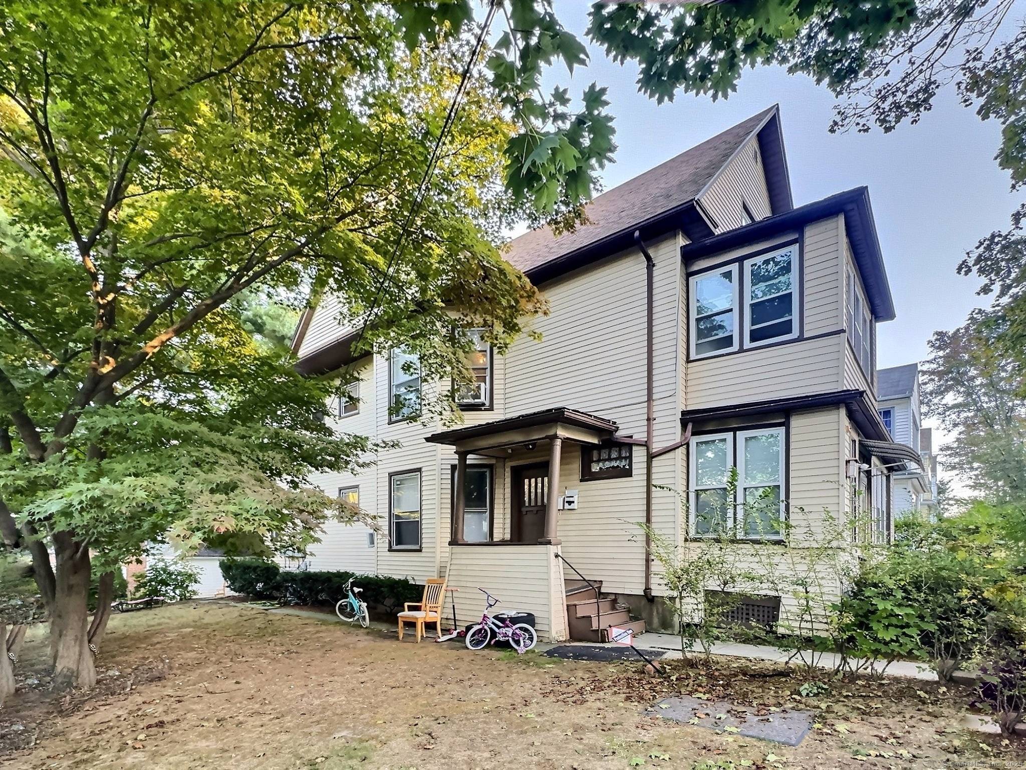Welcome to 2 Rodney Street, a charming multi family home nestled in Hartford's historic West End.
