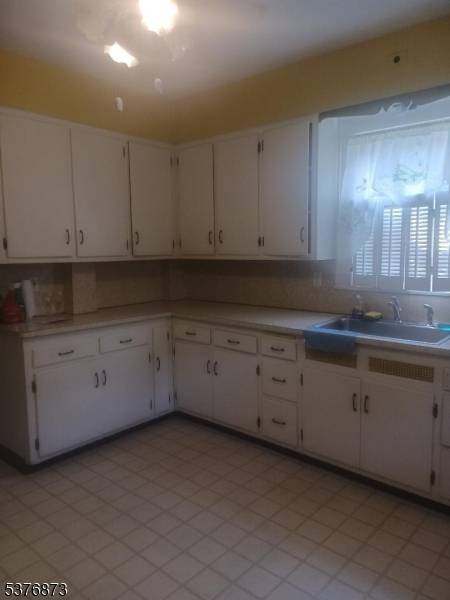 Charming Colonial with beautiful Parquet Floors w ribbon trim in Living Room, Dining Room and Family Room.