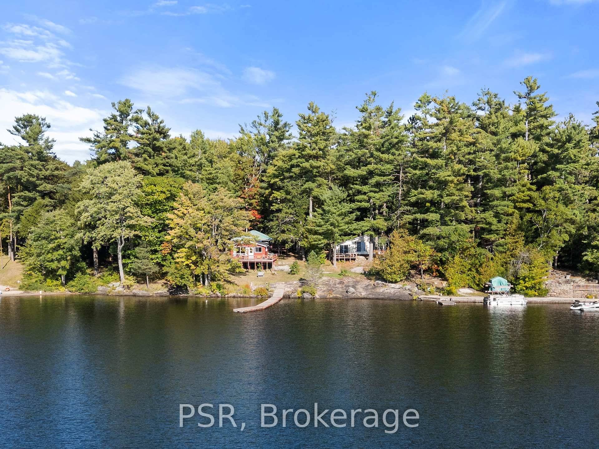Exceptional Multi Cottage, Commercially Zoned Property on the Moon River in the Heart of Bala !