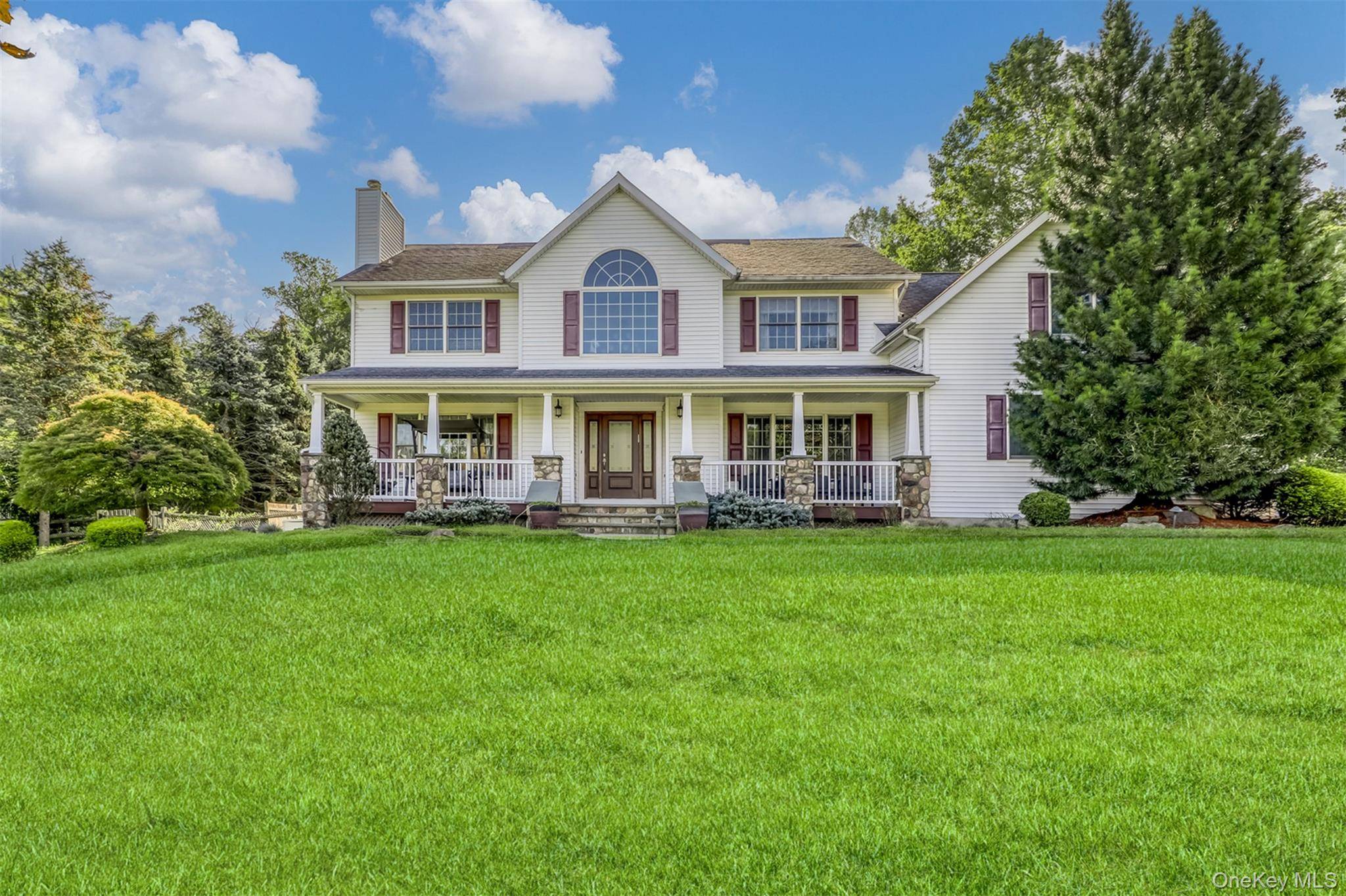 Absolutely stunning 5 bedroom Colonial set on over an acre of beautifully manicured, gated grounds.