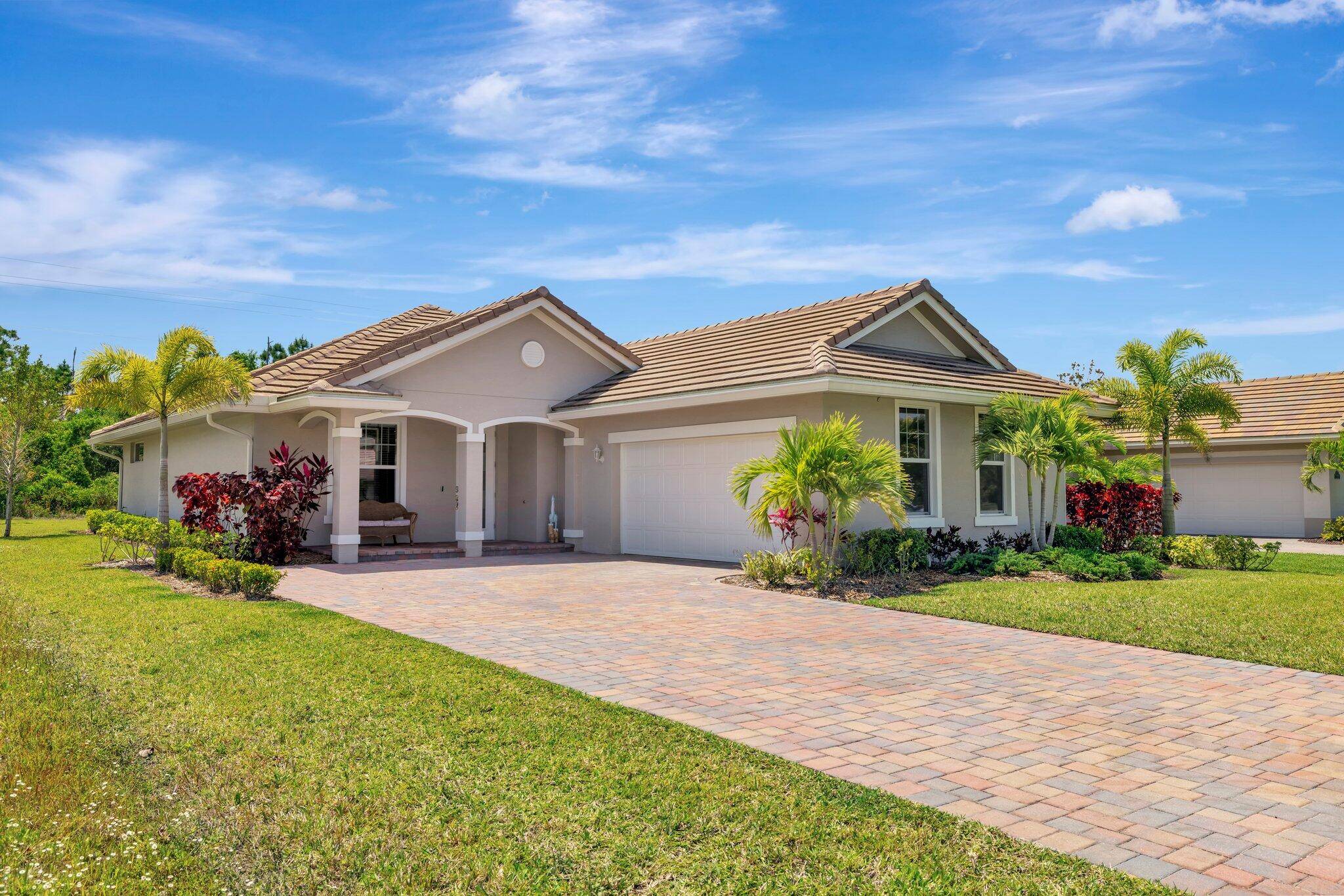 Built in 2022, this ranch style home offers an open concept layout with high ceilings and tile throughout.
