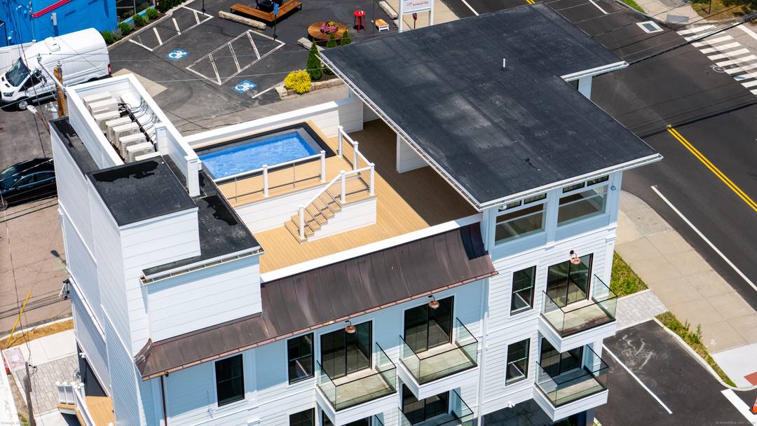 This property offers an incredible opportunity to own a small boutique hotel with with upscale rooftop amenities and offering great views of Mystic all while enjoying the rooftop dip pool, ...