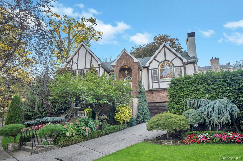 Welcome to 120 Marion Avenue A Stunning Tudor Style Retreat with Timeless Elegance and Resort Style Living.