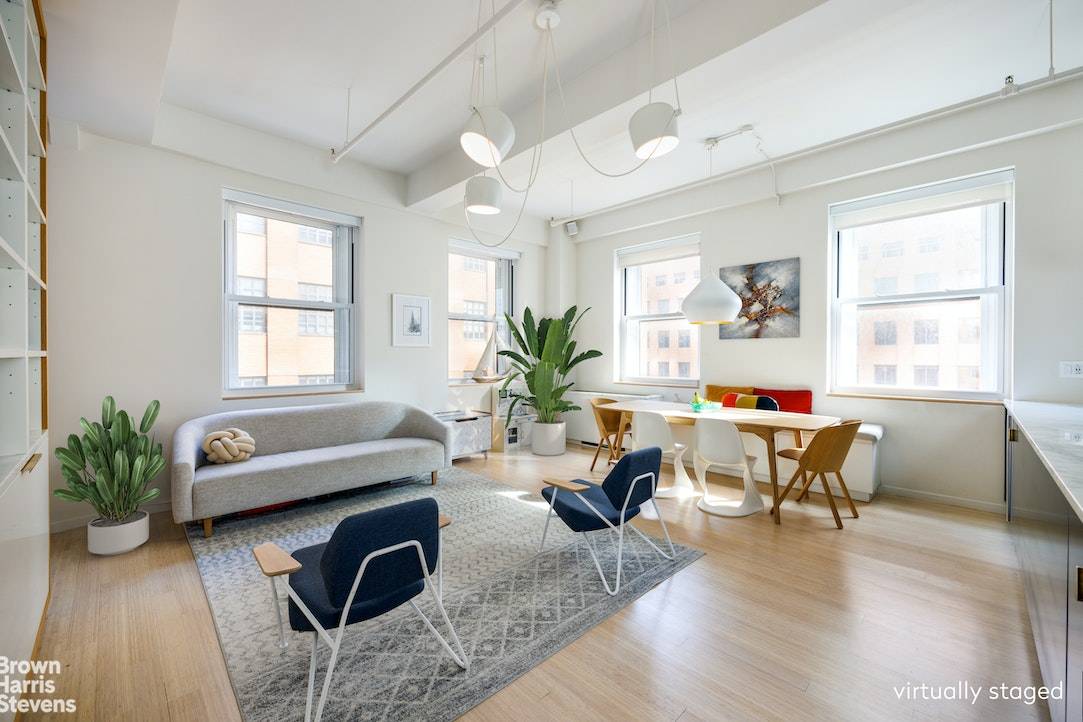With 1, 800 SF of living space and nearly 11' ceilings, this expansive CORNER LOFT has it all.