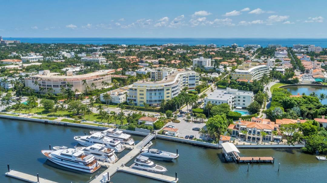 Absolutely breathtaking panoramic views of the Intracoastal Waterway await from the expansive wraparound terraces of this exceptional penthouse, offering some of the finest vistas in Palm Beach.