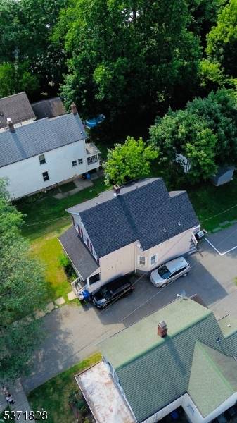 Discover this rare find two separate two family homes on one lot, perfectly situated in the vibrant center of Dover.