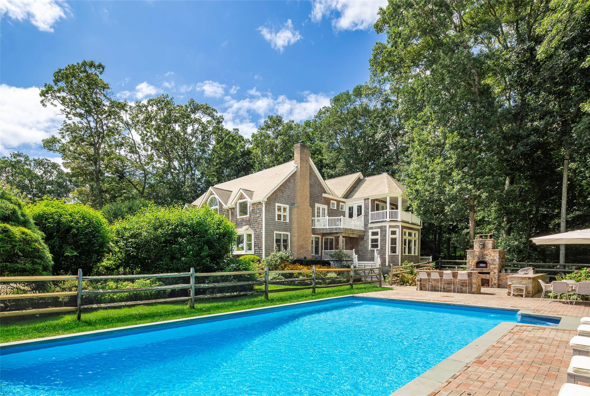 Fields in the Foreground, A Legacy Behind the Gate Set beyond a private gate, this stunning estate offers expansive acreage and breathtaking farm field vistas, creating a rare retreat in ...