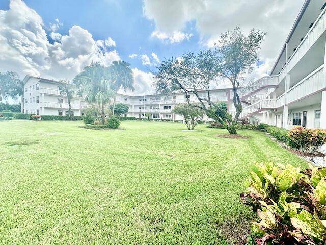1 1. 5, 3rd floor, updated kitchen, wood look floor in kitchen and dining area, carpet in living area and bedroom, screened patio overlooking magnificent lake view.