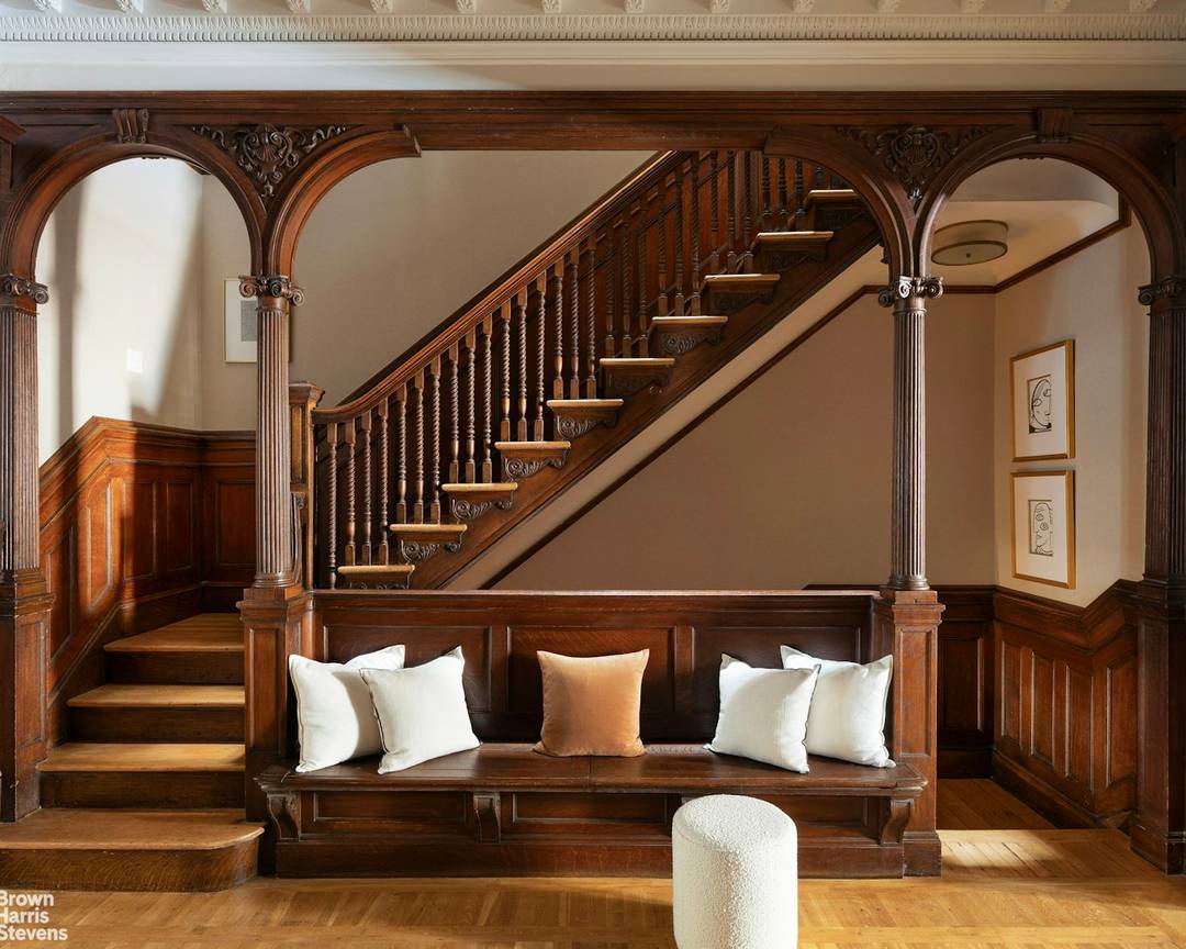 Built at the turn of the century by renowned architects Buchman and Deisler, this stately limestone townhouse sits on a historic landmark block between Madison and Park Avenues.