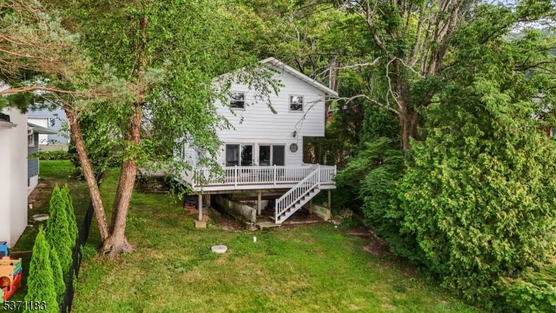 Opportunity awaits in this desirable neighborhood make your dream of living on the water come true in this lakefront home with stunning sunset views, private boat house and dock !