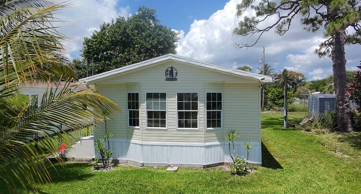 NO HOA ! Less than 1 mile from Manatee Pocket, and across the street from The Great Salerno Basin.