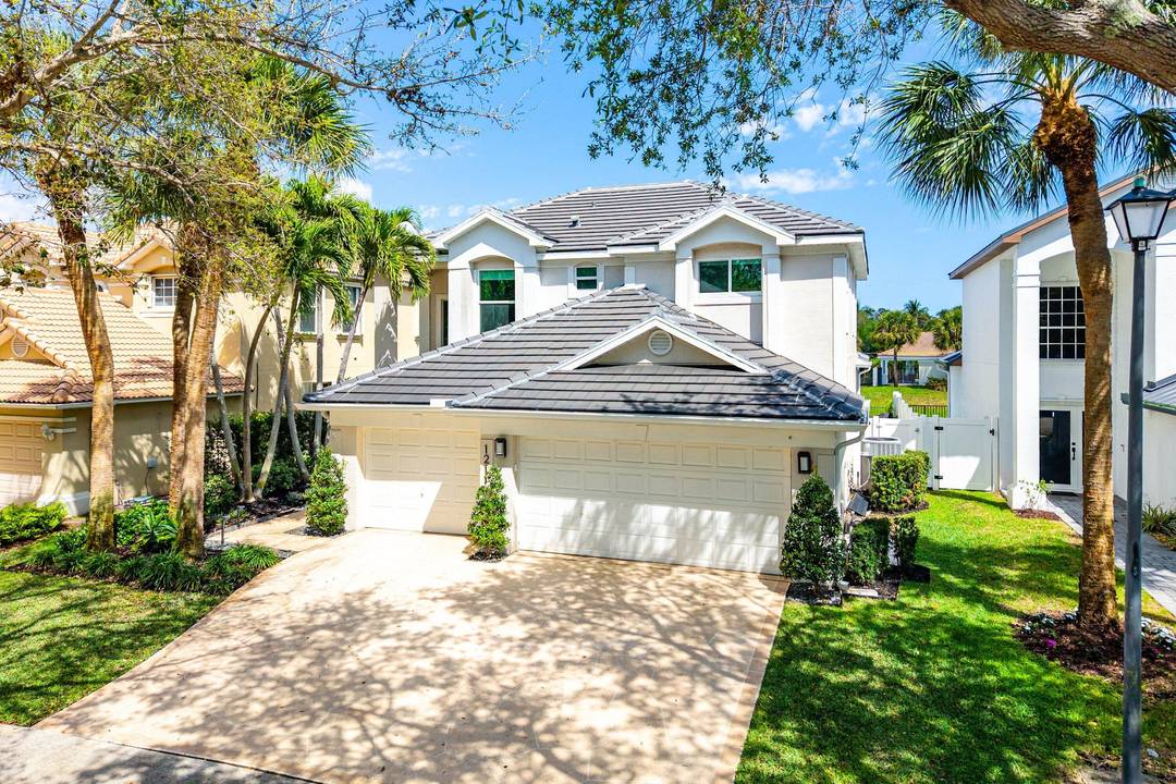 Welcome to 1211 Delray Lakes Drive, a spacious, move in ready two story home in gated Delray Lakes in Delray Beach.