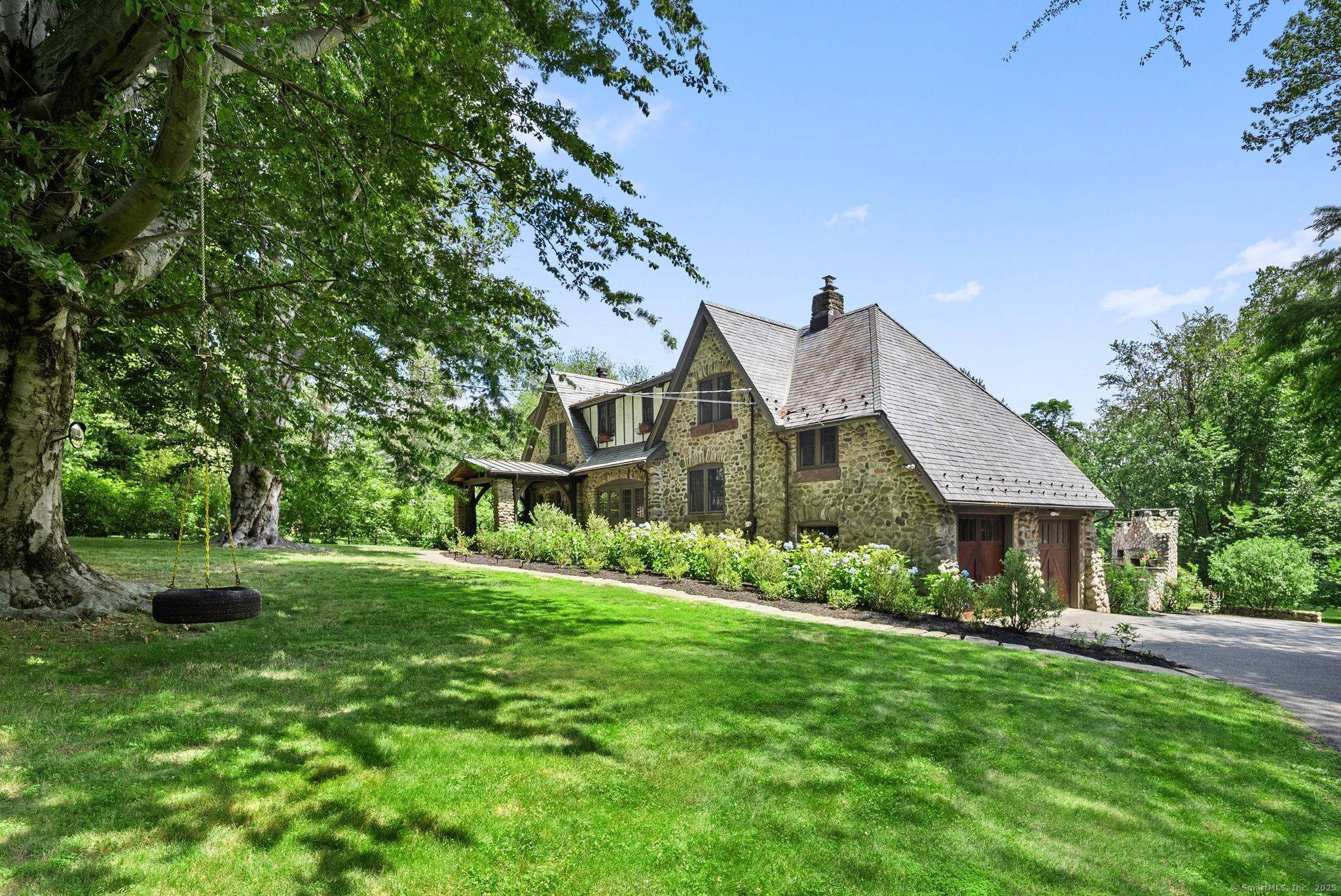 Truly One of a Kind. This iconic Fairfield Tudor Revival blends rich architectural heritage with elevated modern luxury.
