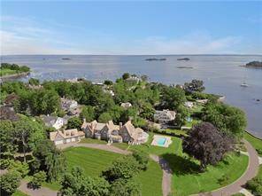 Belle Haven Newport style stone shingle masterpiece perched high on 2.