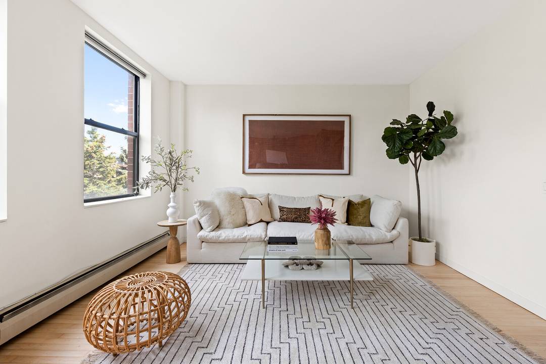 Bright and spacious, this Greenwood two bedroom, two bath condo is filled with sunlight, character, and smart design.