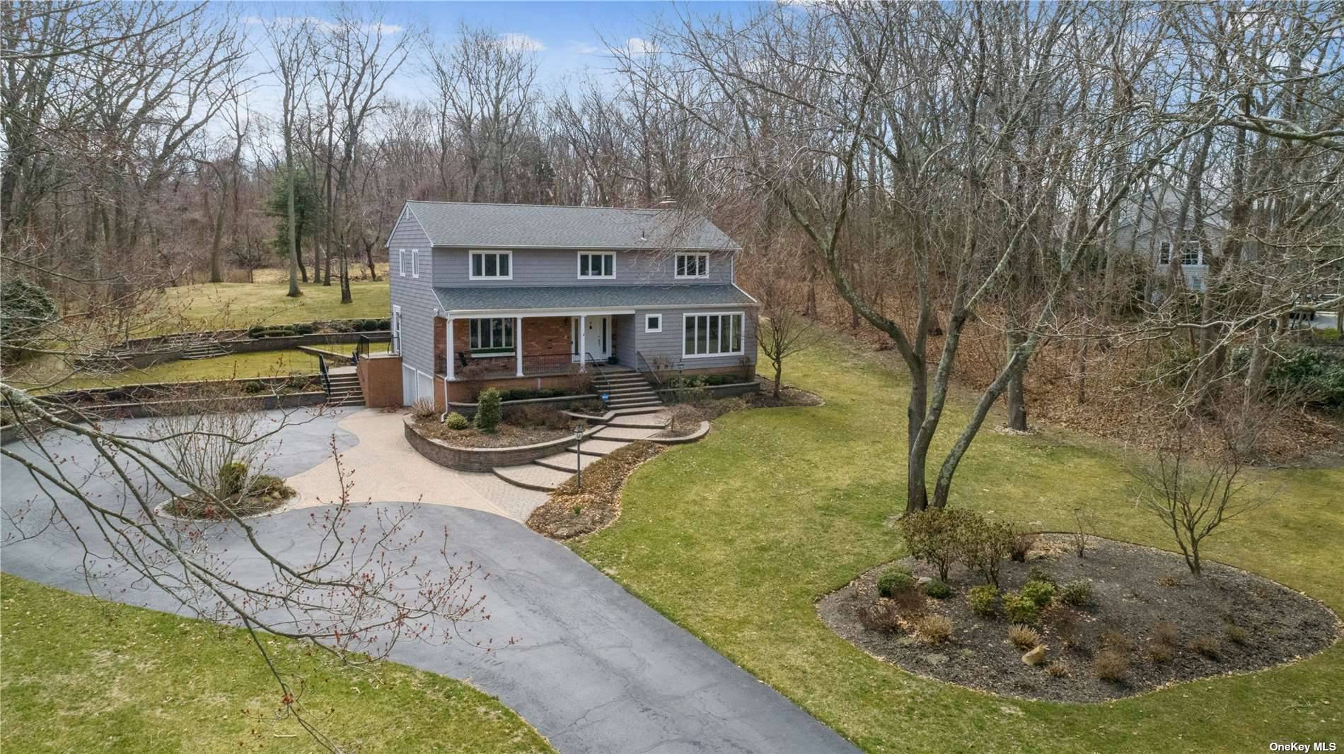 Welcome to 6 York Ct, nestled in the hills of prestigious Fort Salonga Northport situated on a stunning beautifully manicured park like acre in a private 11 home cul de ...