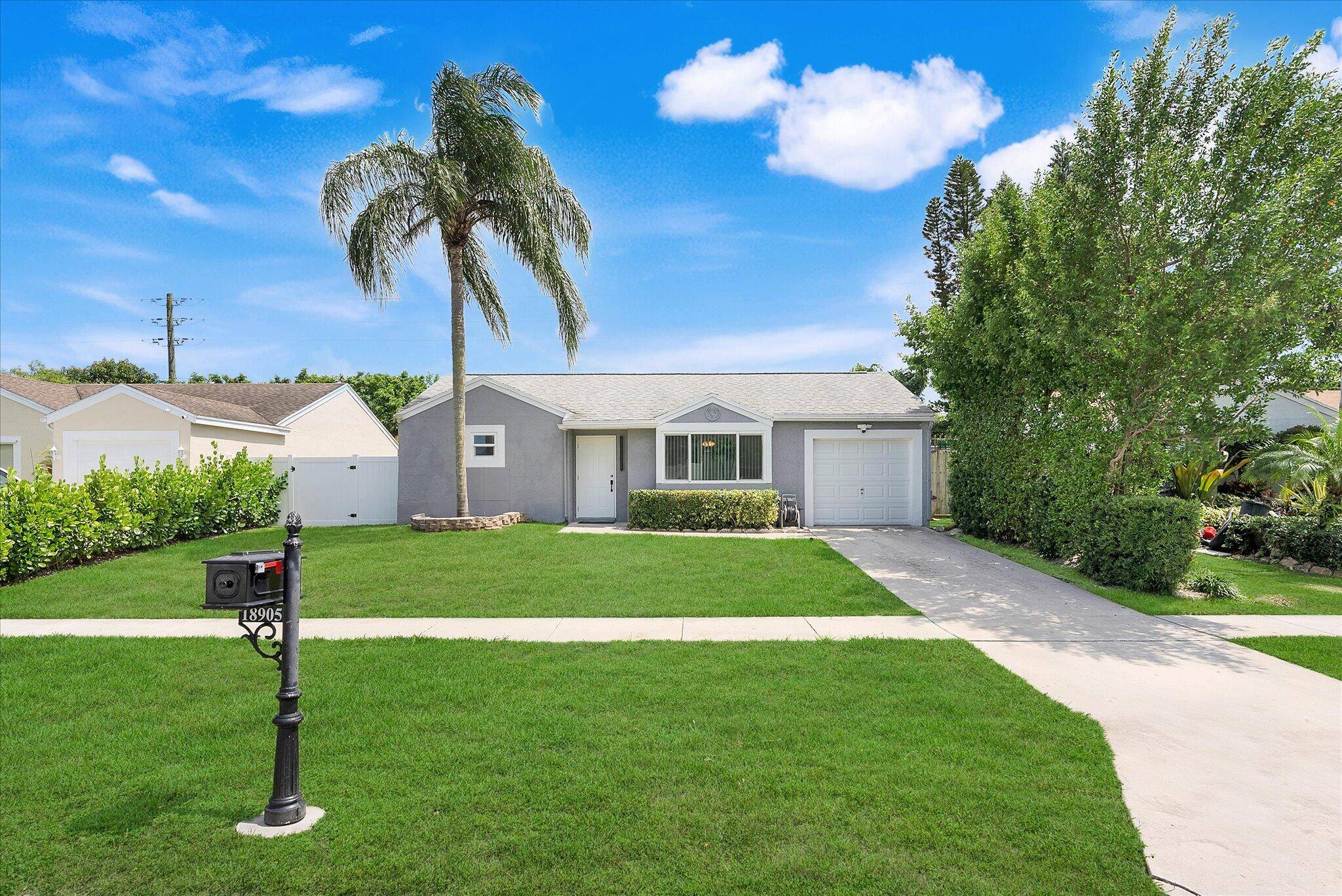 EXQUISITELY REMODELED home w LOW HOA in highly desirable West Boca neighborhood zoned for A RATED SCHOOLS.