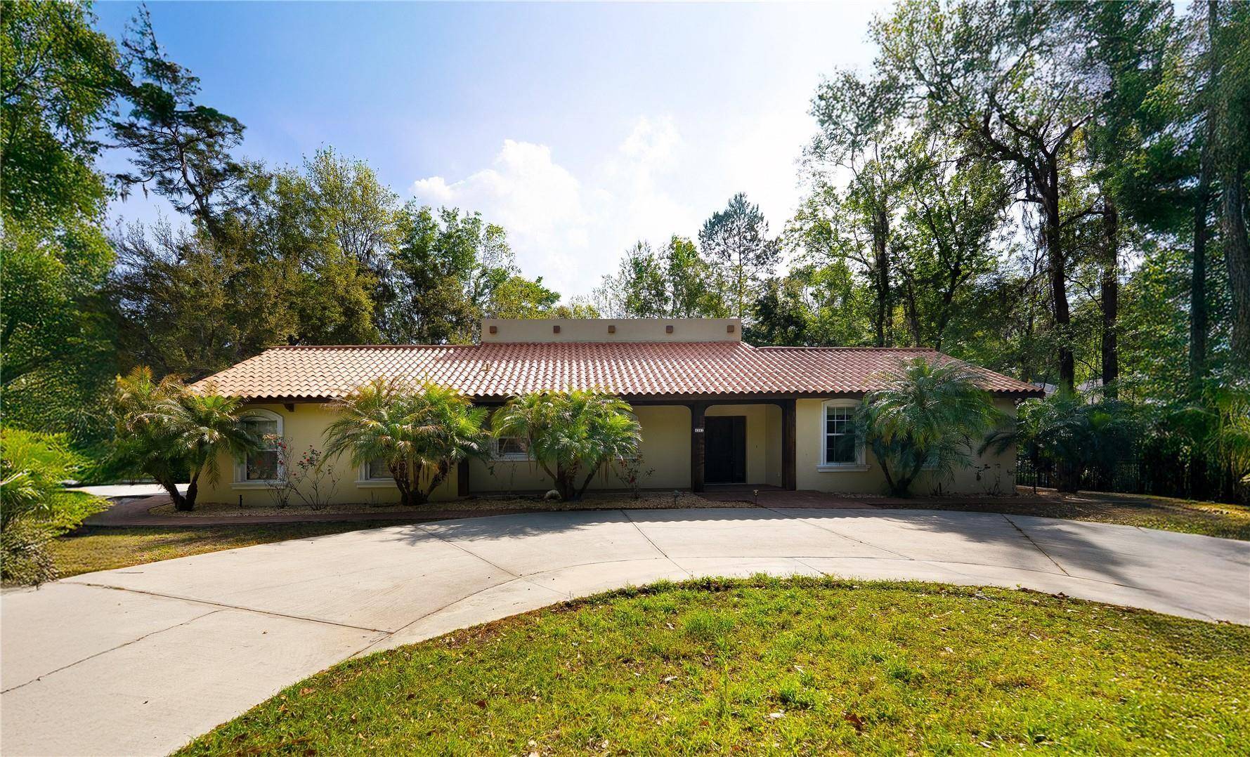 Discover this spacious Hacienda style home located on a generous.