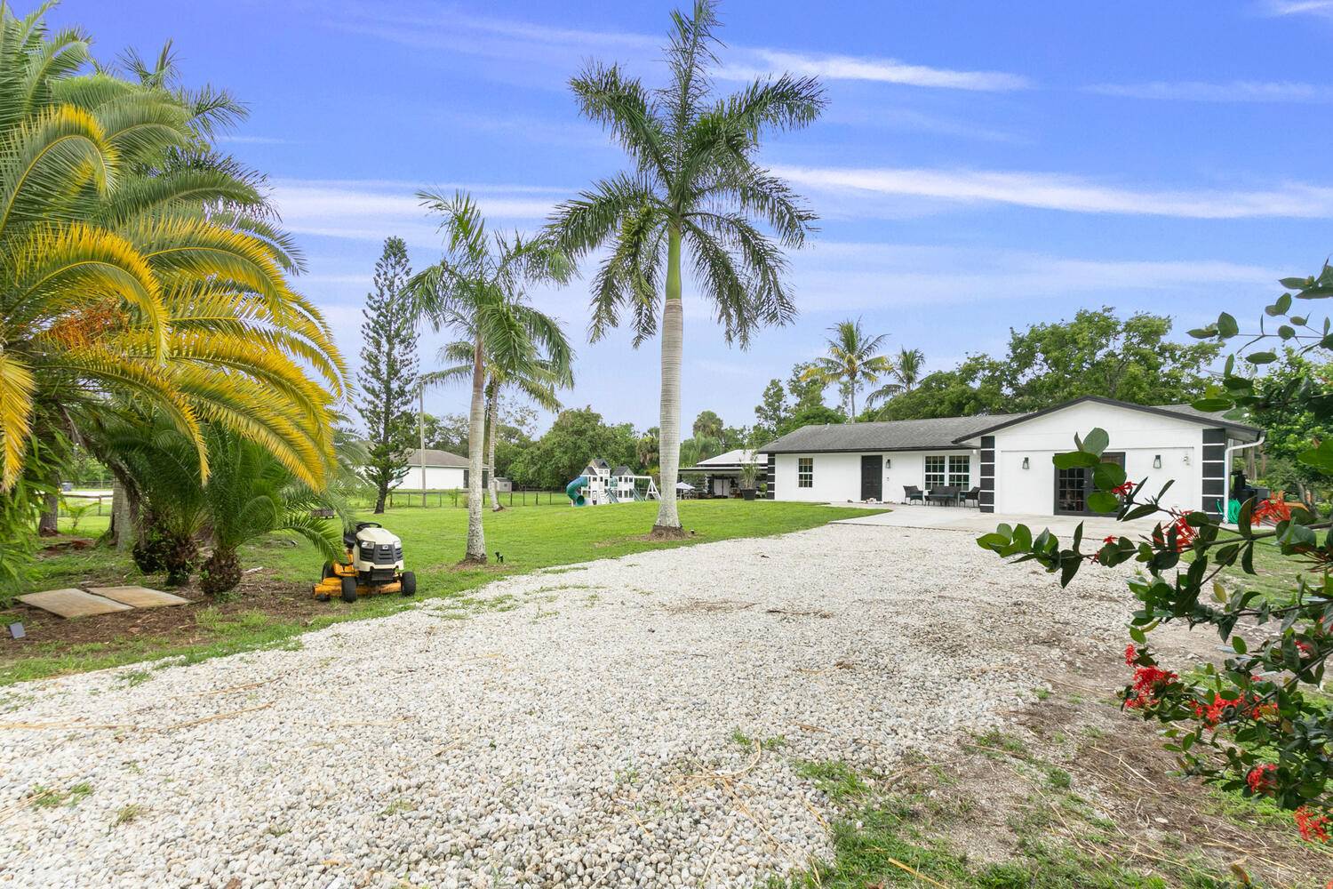 Corner lot home with barn now available in the Acreage !